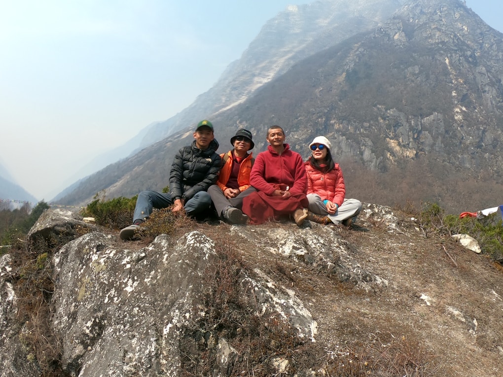 Climber sitting on mountain peak